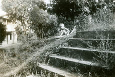 Jean on her banana leaf boat.jpg